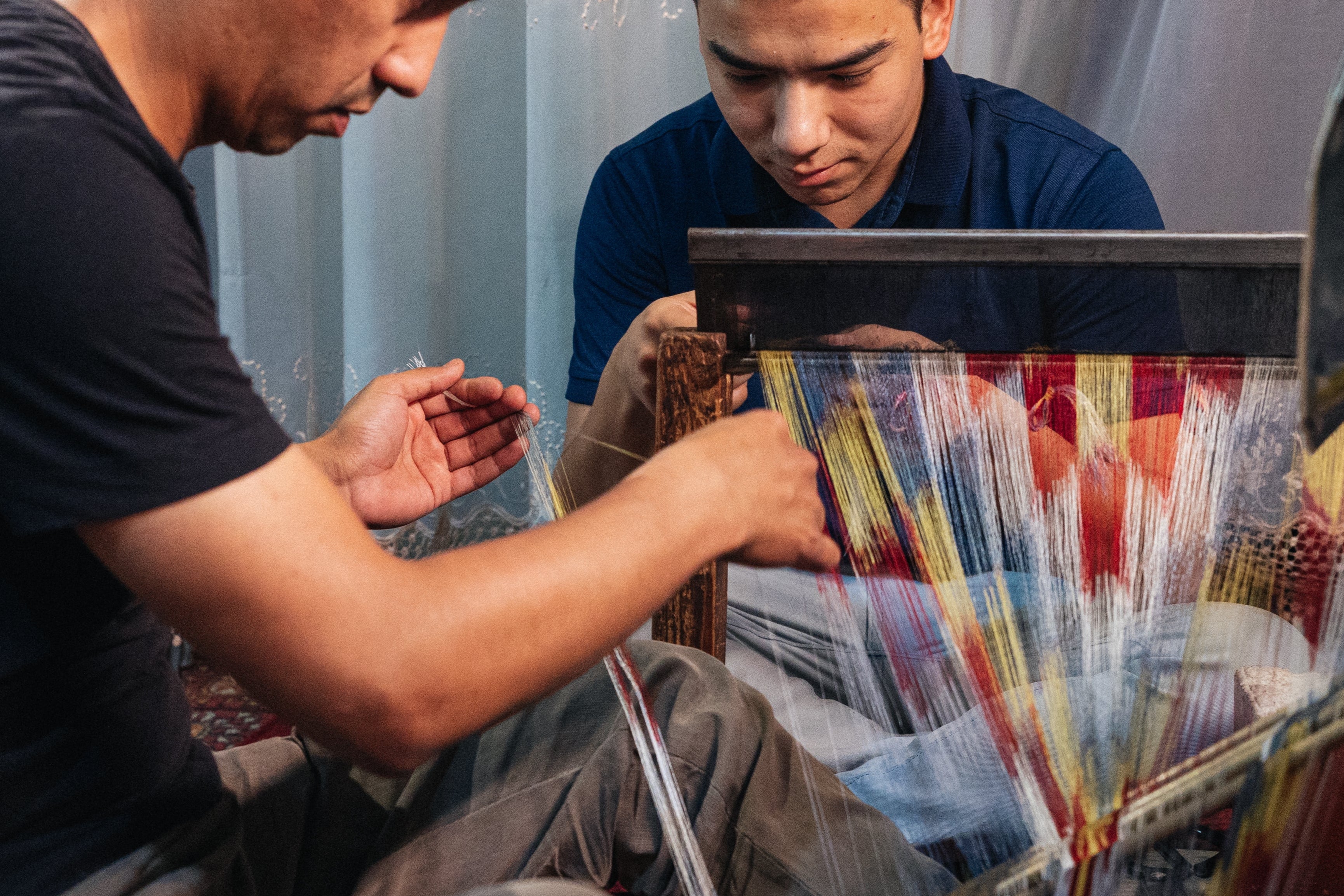 Artisans weaving silk ikat heritage sustainable textiles