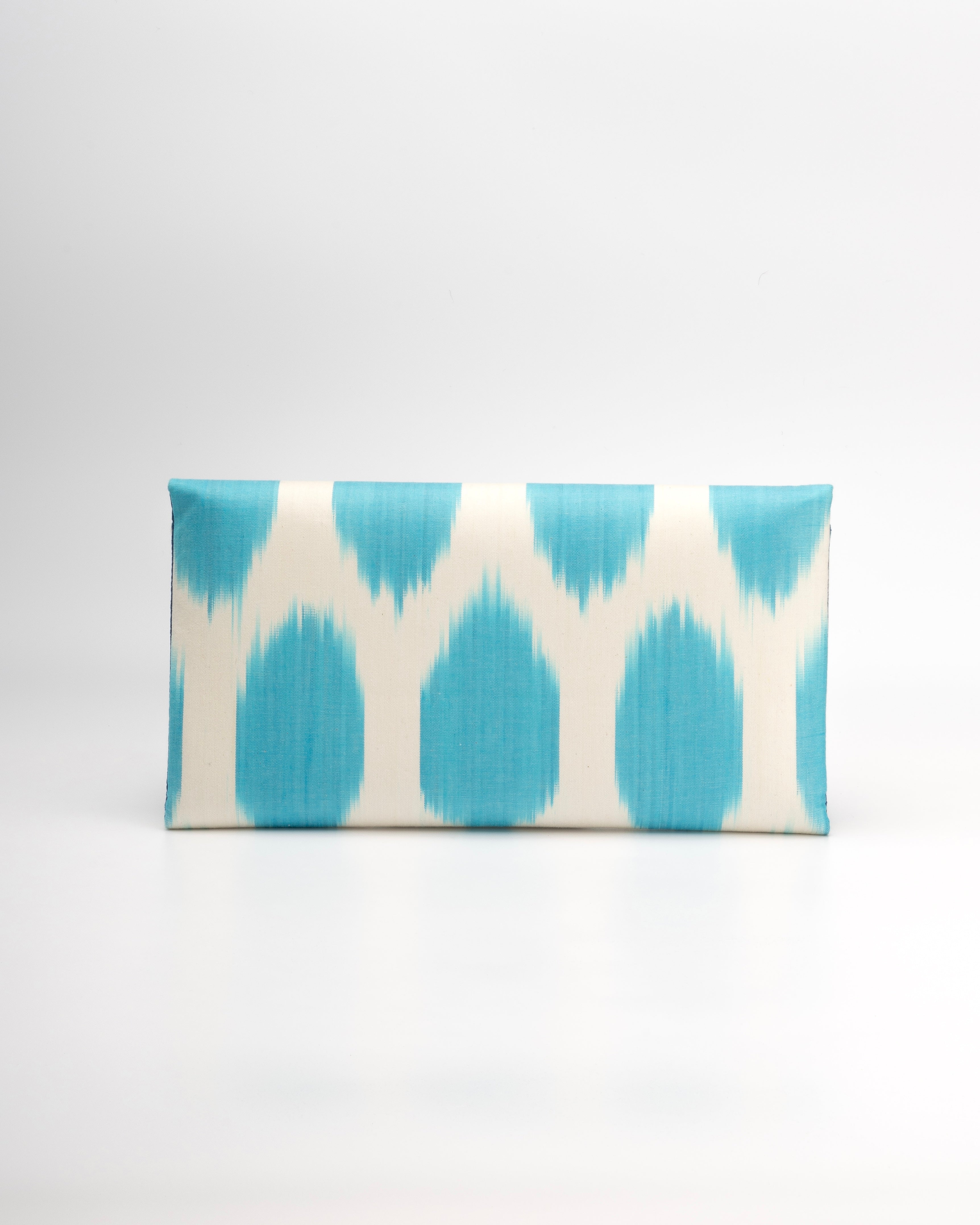 Frankitas envelope clutch in vibrant handwoven Silk Ikat with polka-dot pattern rooted in heritage weaving