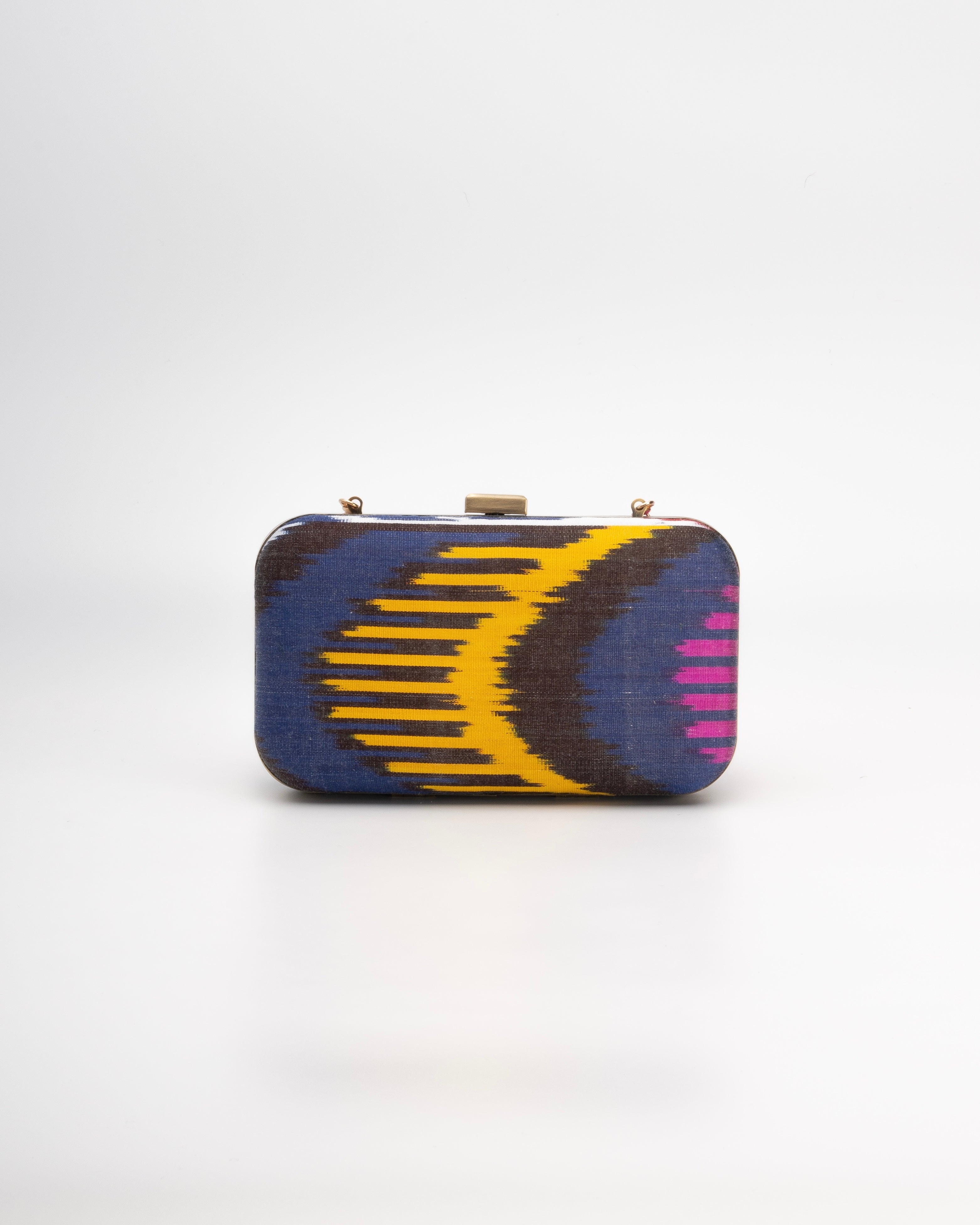 Contemporary Frankitas clutch made from traditional multicolor silk ikat fabric, handmade by artisans
