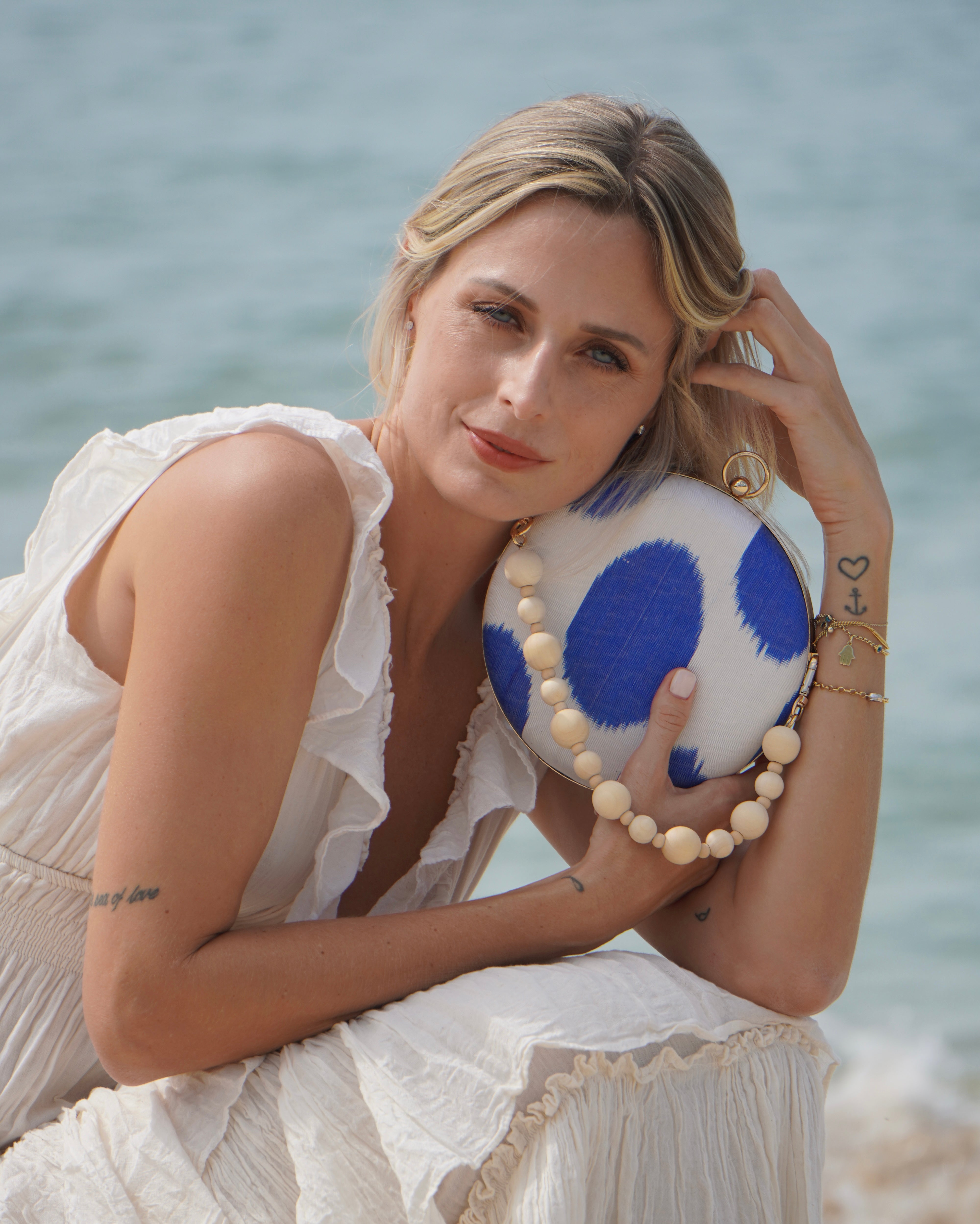 Regal-inspired Frankitas clutch in round silhouette, made with hand-loomed silk Ikat from Uzbekistan