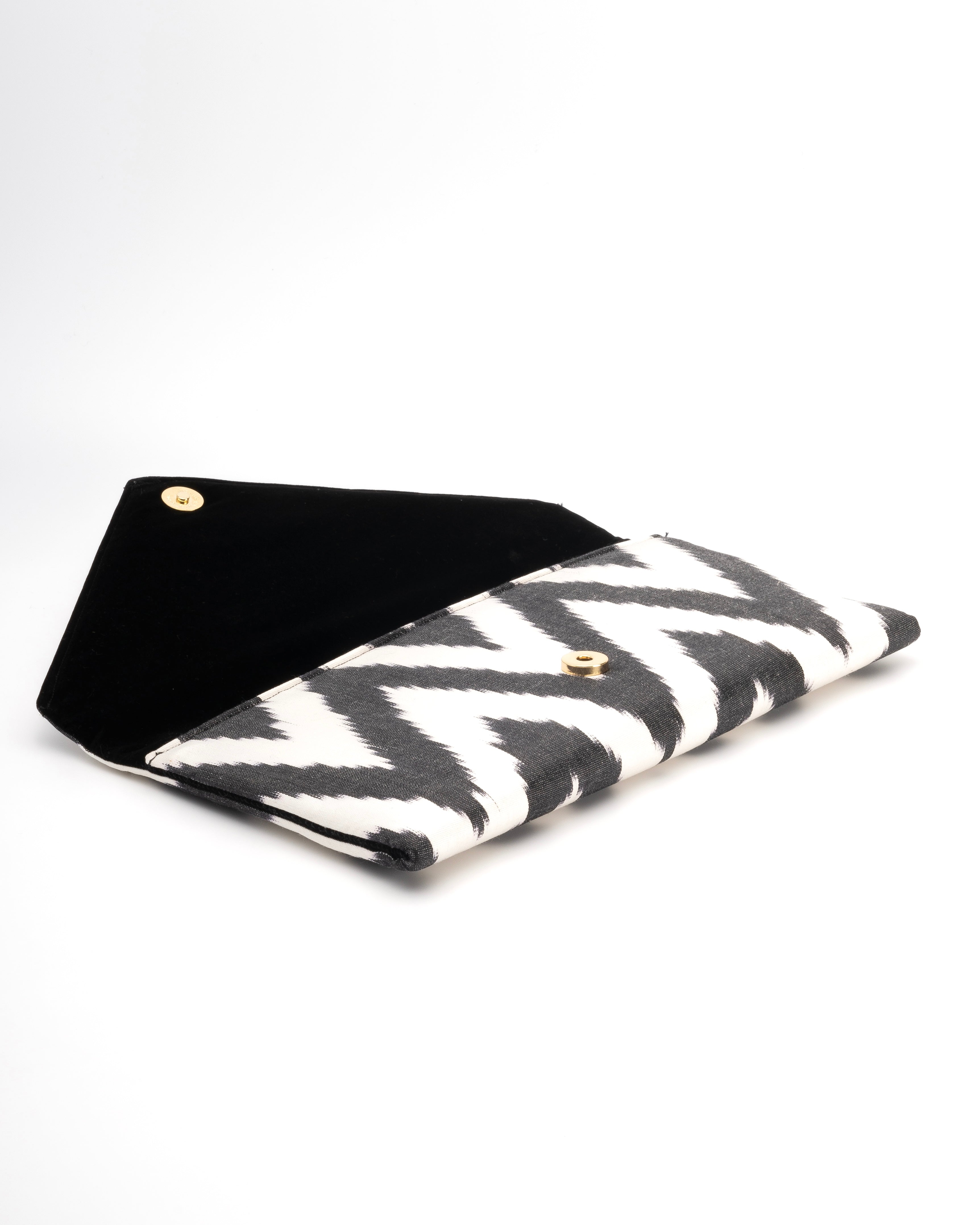 Frankitas envelope-style clutch in a classic black and white chevron Ikat, embodying heritage and style