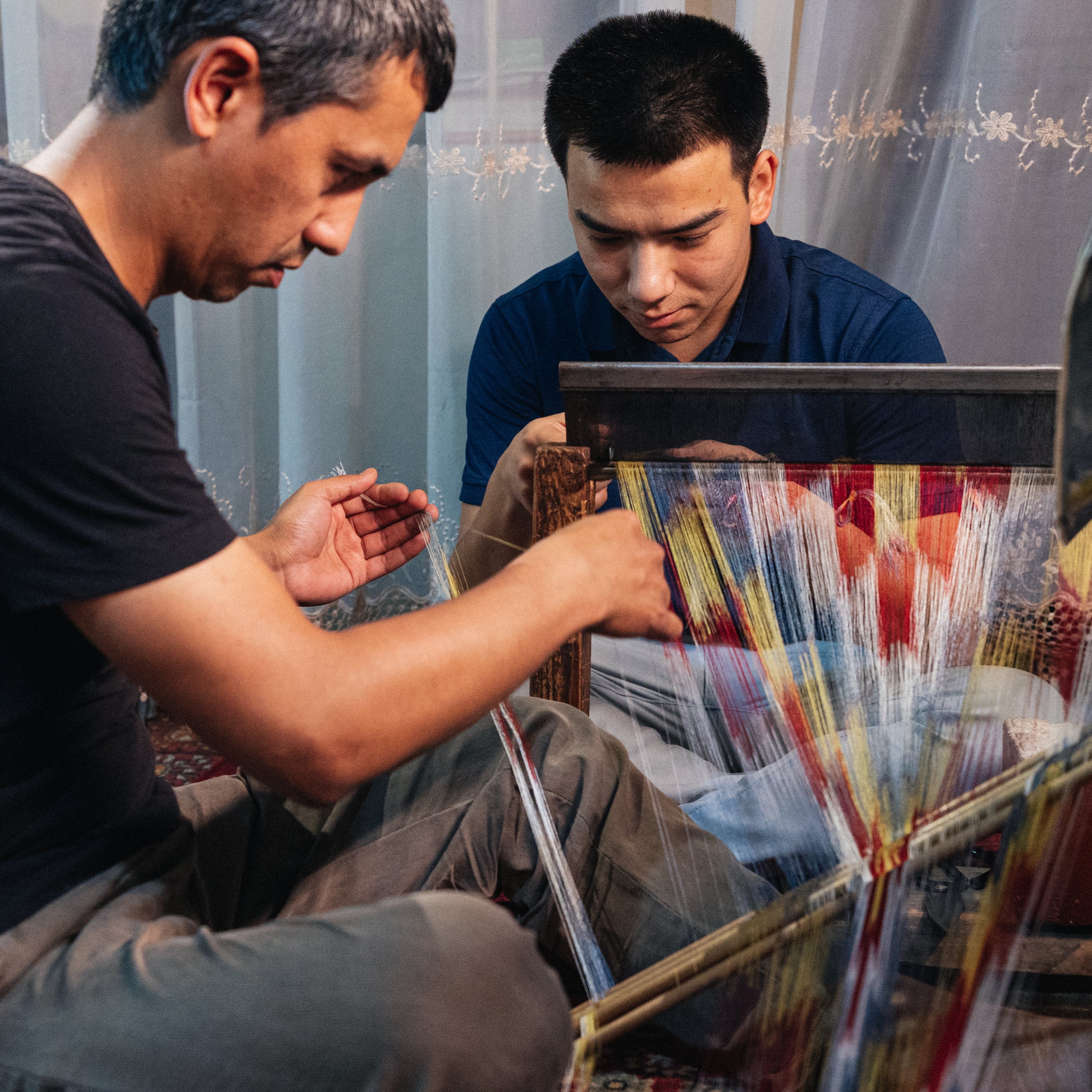 Artisans weaving silk ikat heritage sustainable textiles