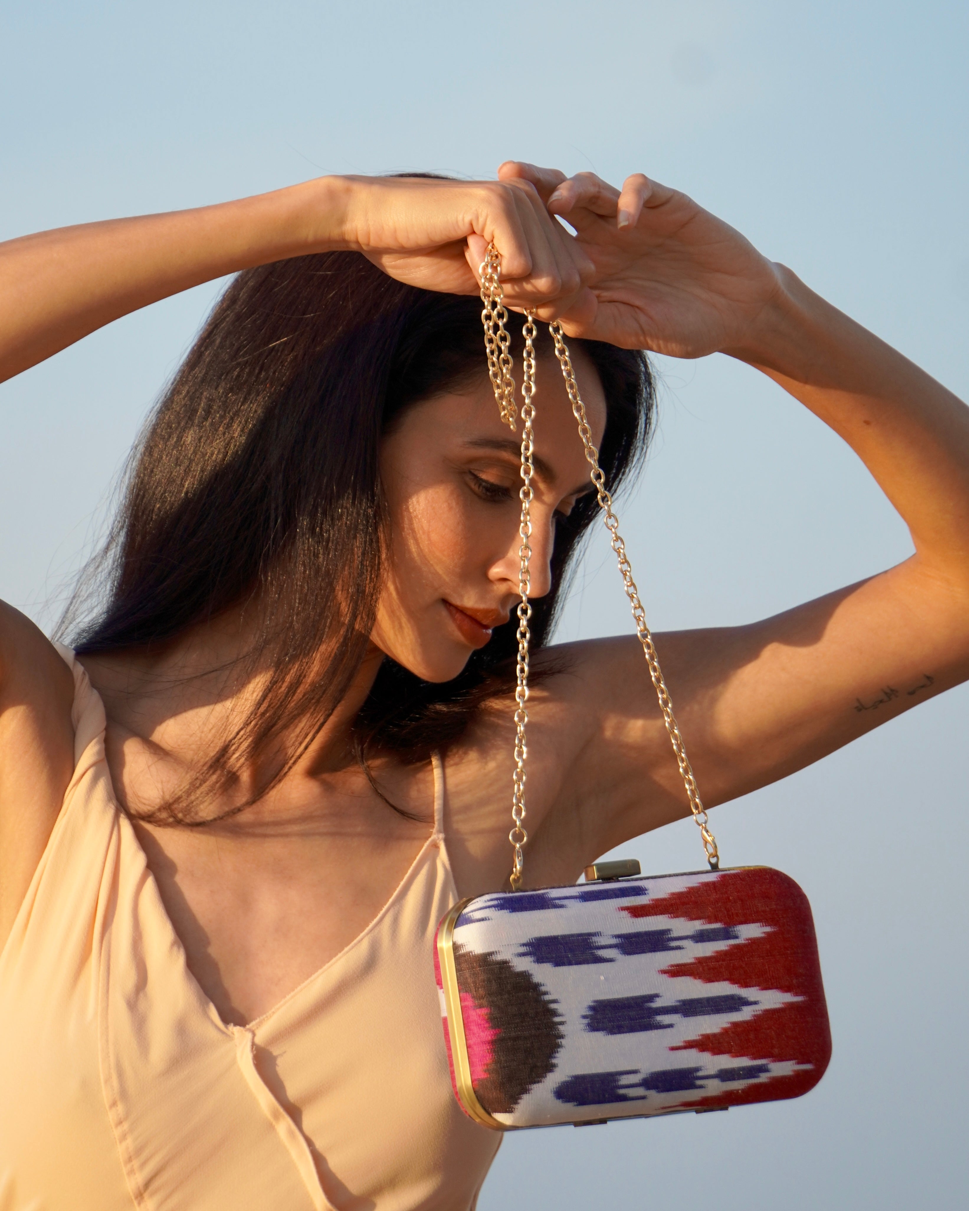 Modern classic clutch by Frankitas made from hand-loomed Ikat fabric with geometric motifs