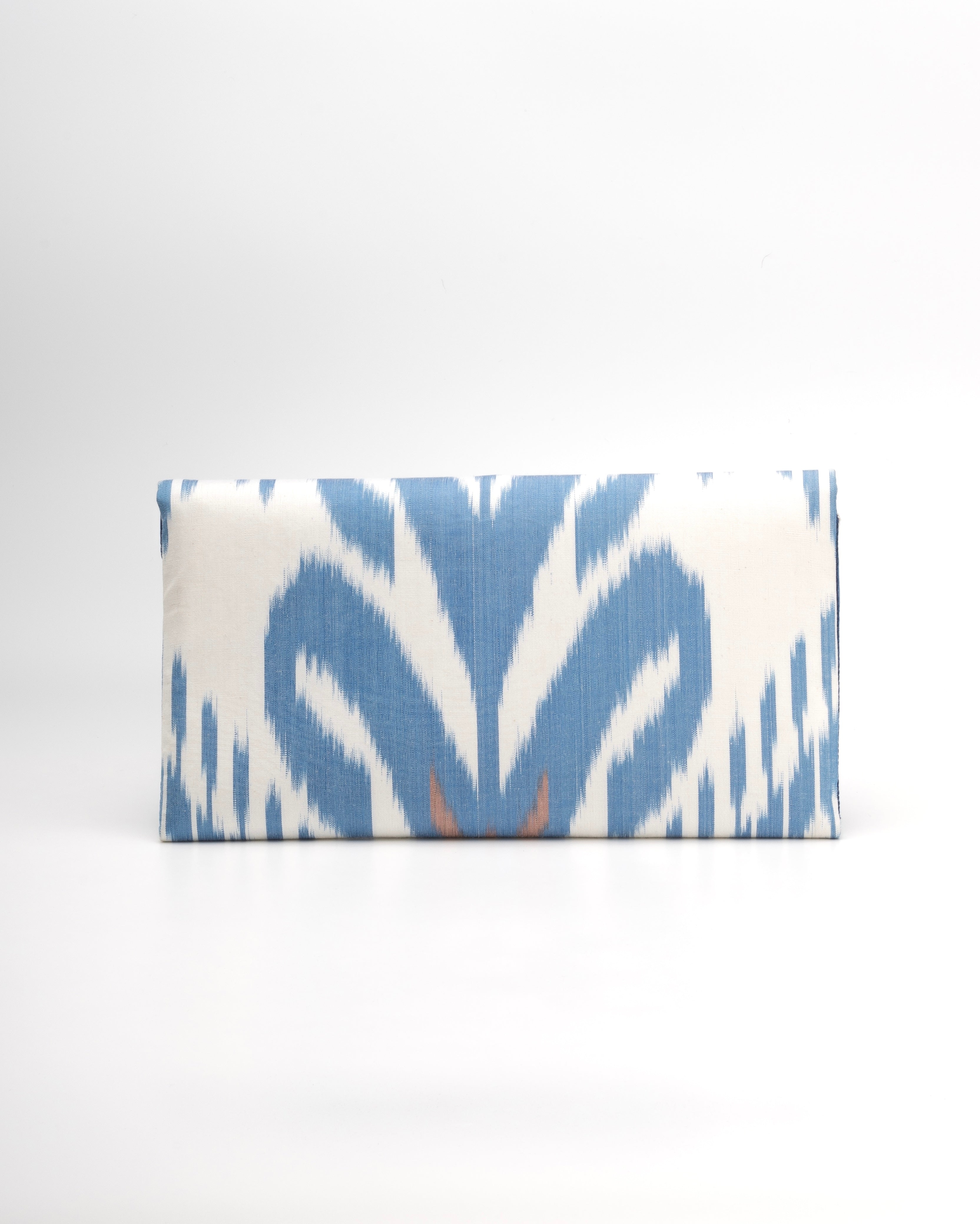 Featuring the beauty of handwoven silk ikat from Uzbekistan on a Frankitas envelope Blue and white patterned clutch 