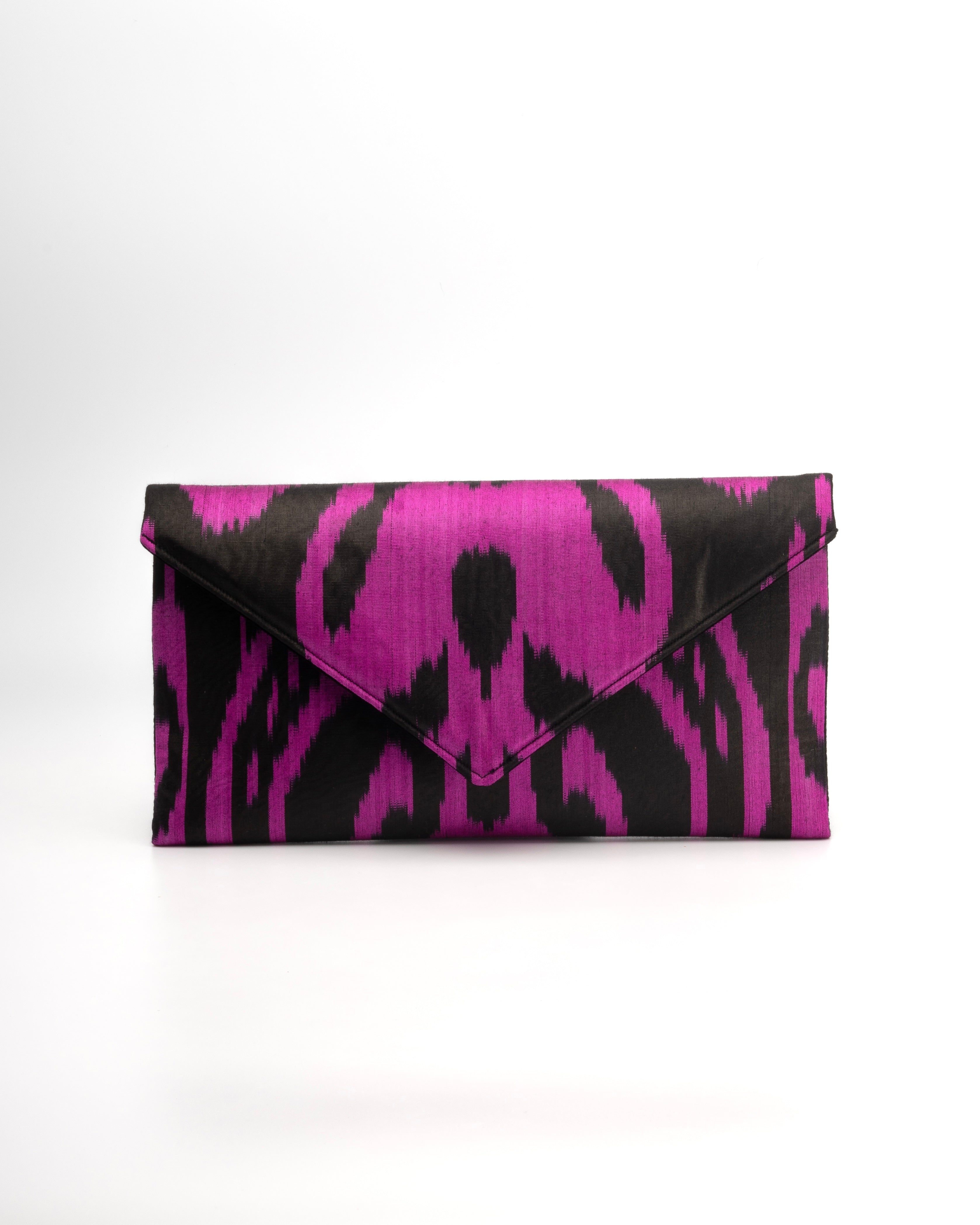 Frankitas envelope clutch  handbag featuring Central Asian tribal silk Ikat in a classic silhouette in hot pink and black