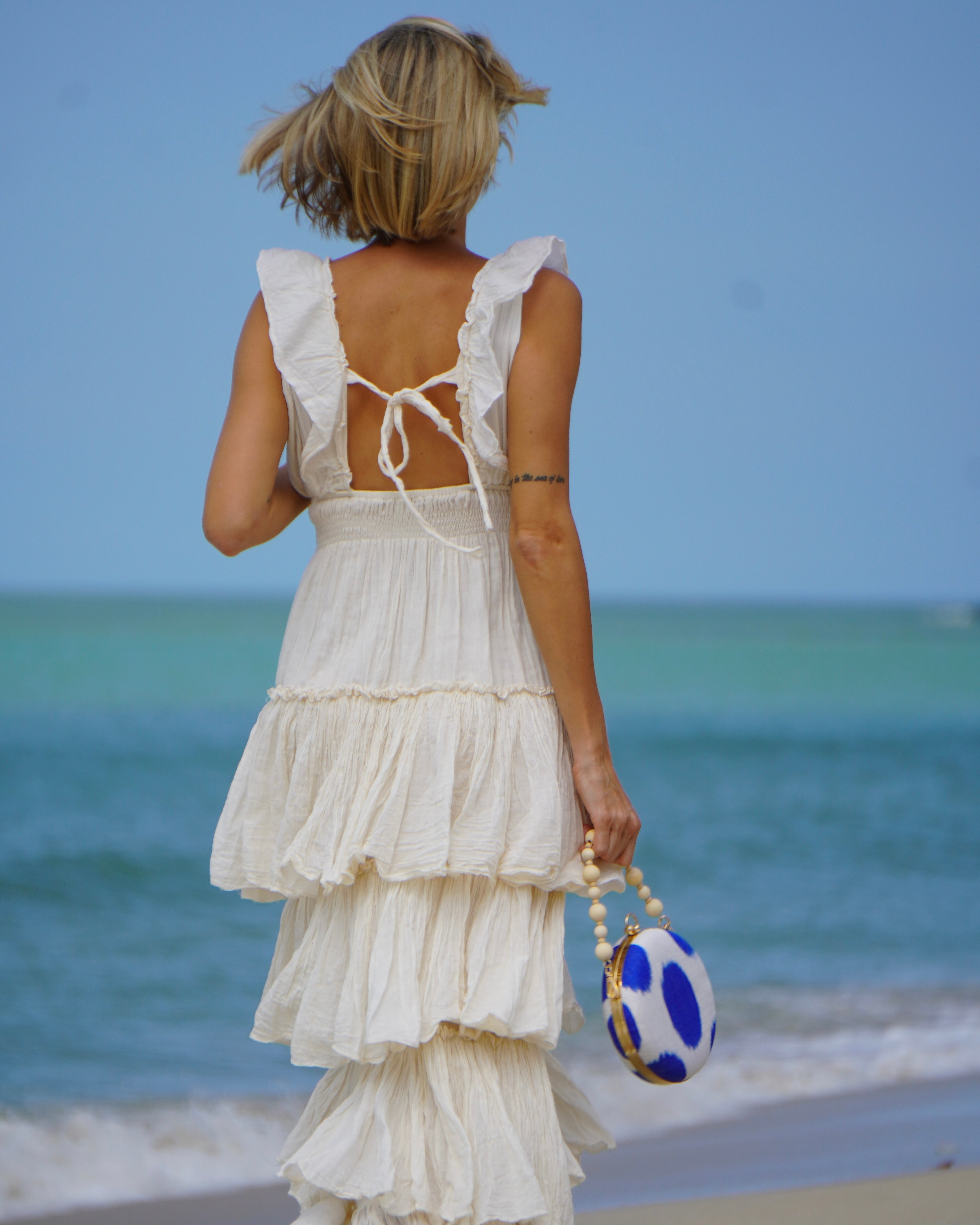 Coastal style with Frankitas cobalt Silk Ikat clutch and white summer dress