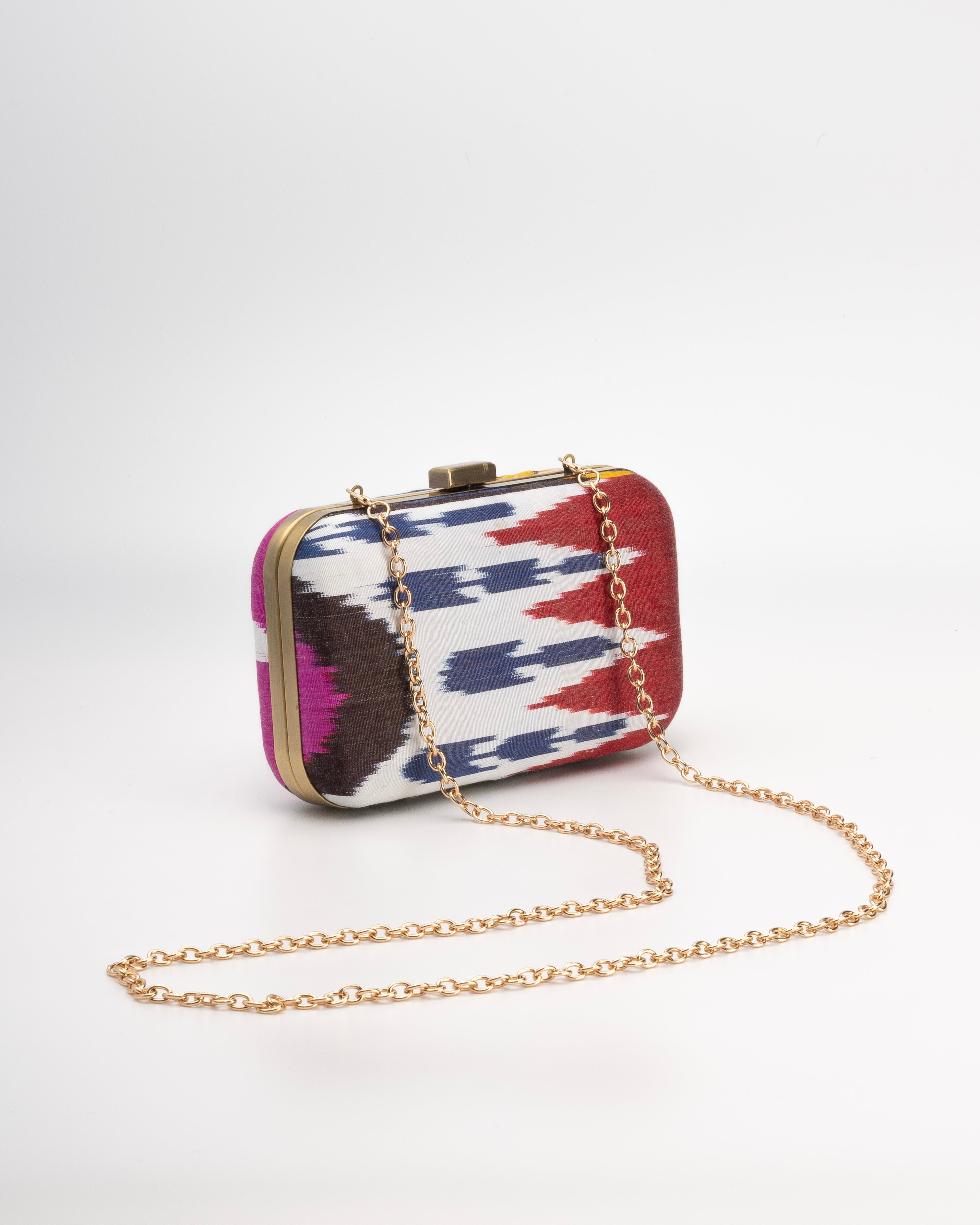 Frankitas handmade clutch bag in traditional multicolor Ikat textile representing artisan heritage