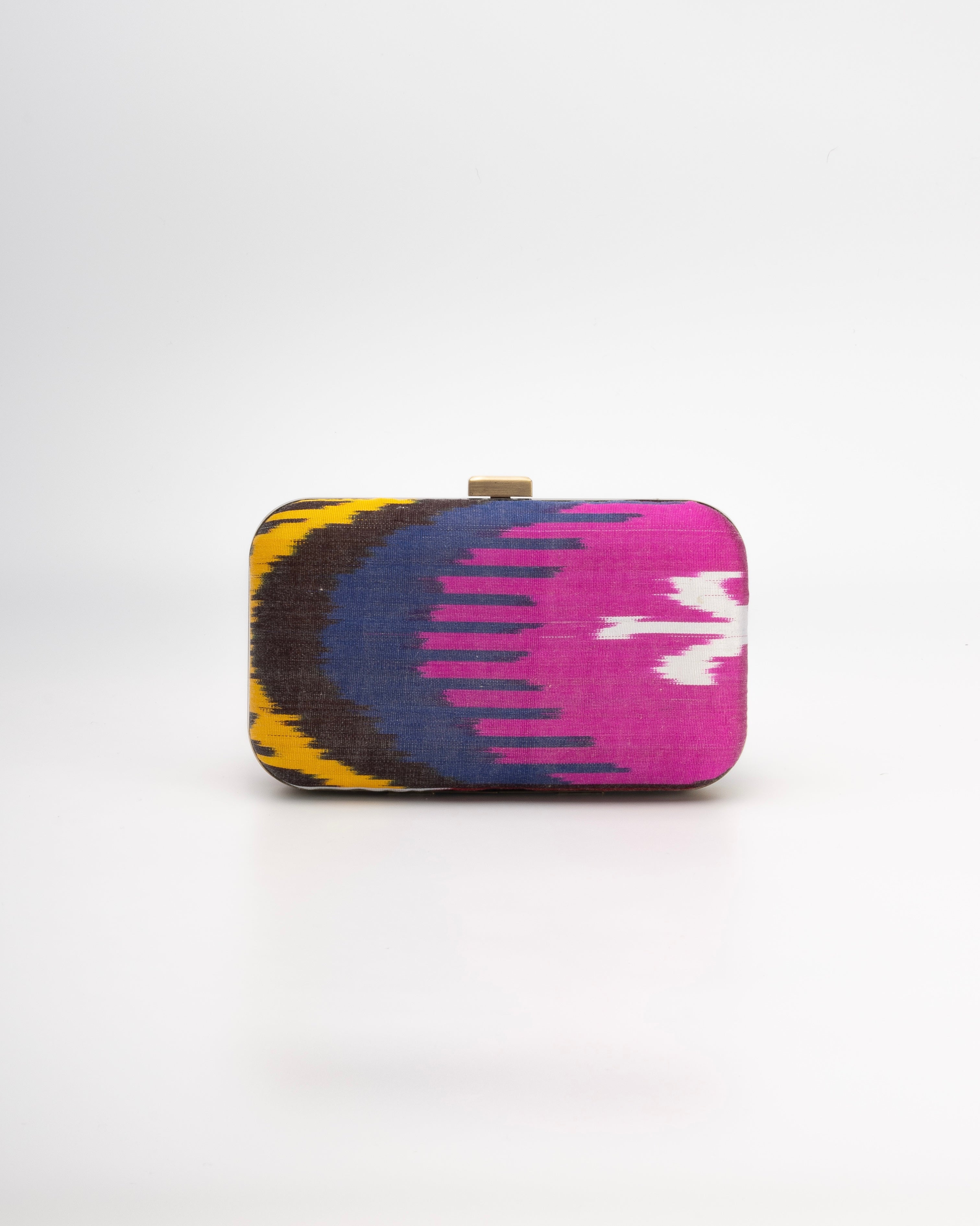 Handwoven Silk Ikat classic clutch bag by Frankitas, featuring bold pink, navy, andyellow traditional motifs