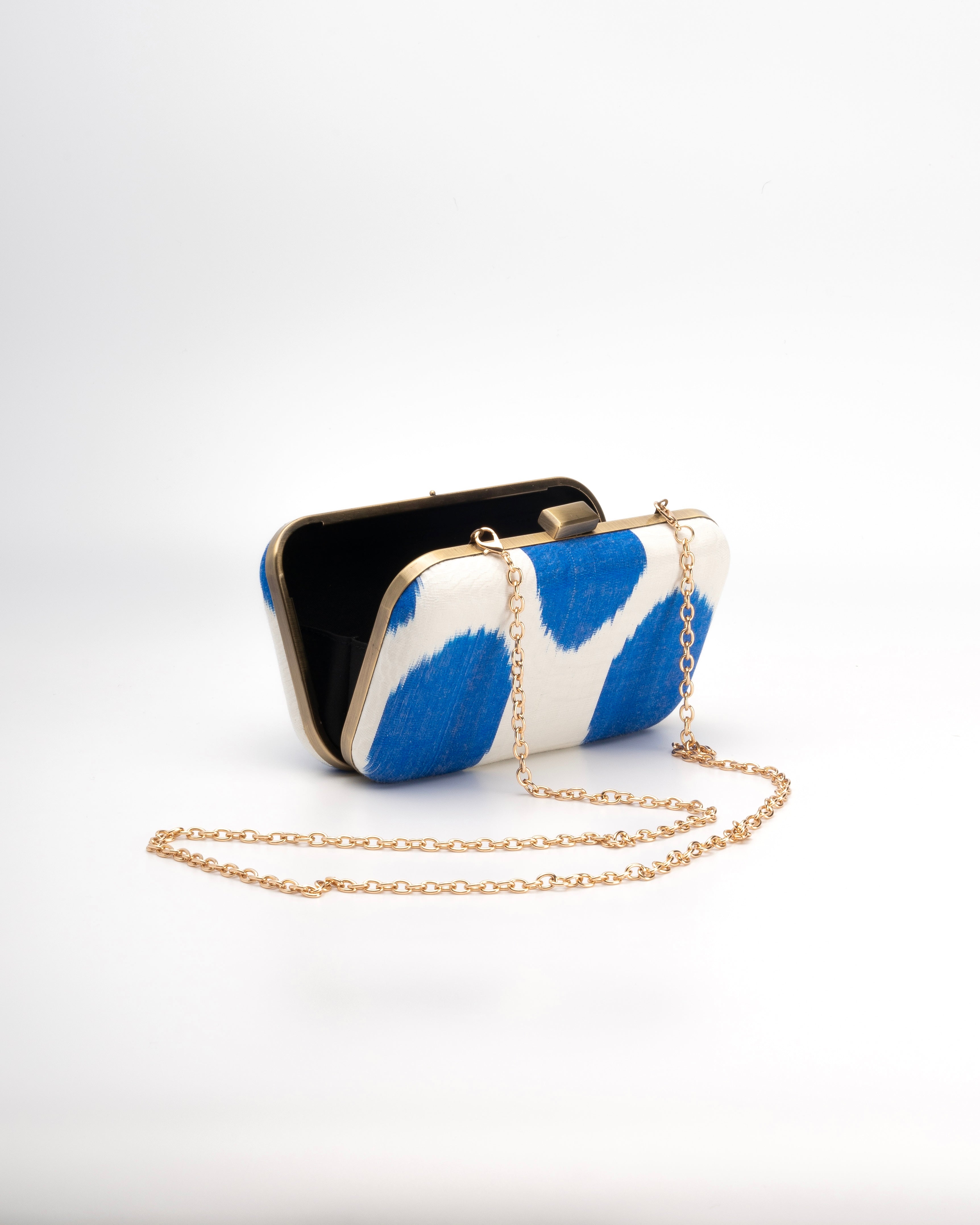 Artisan-made Frankitas clutch crafted with silk Ikat fabric in a rectangular silhouette, blending heritage and style