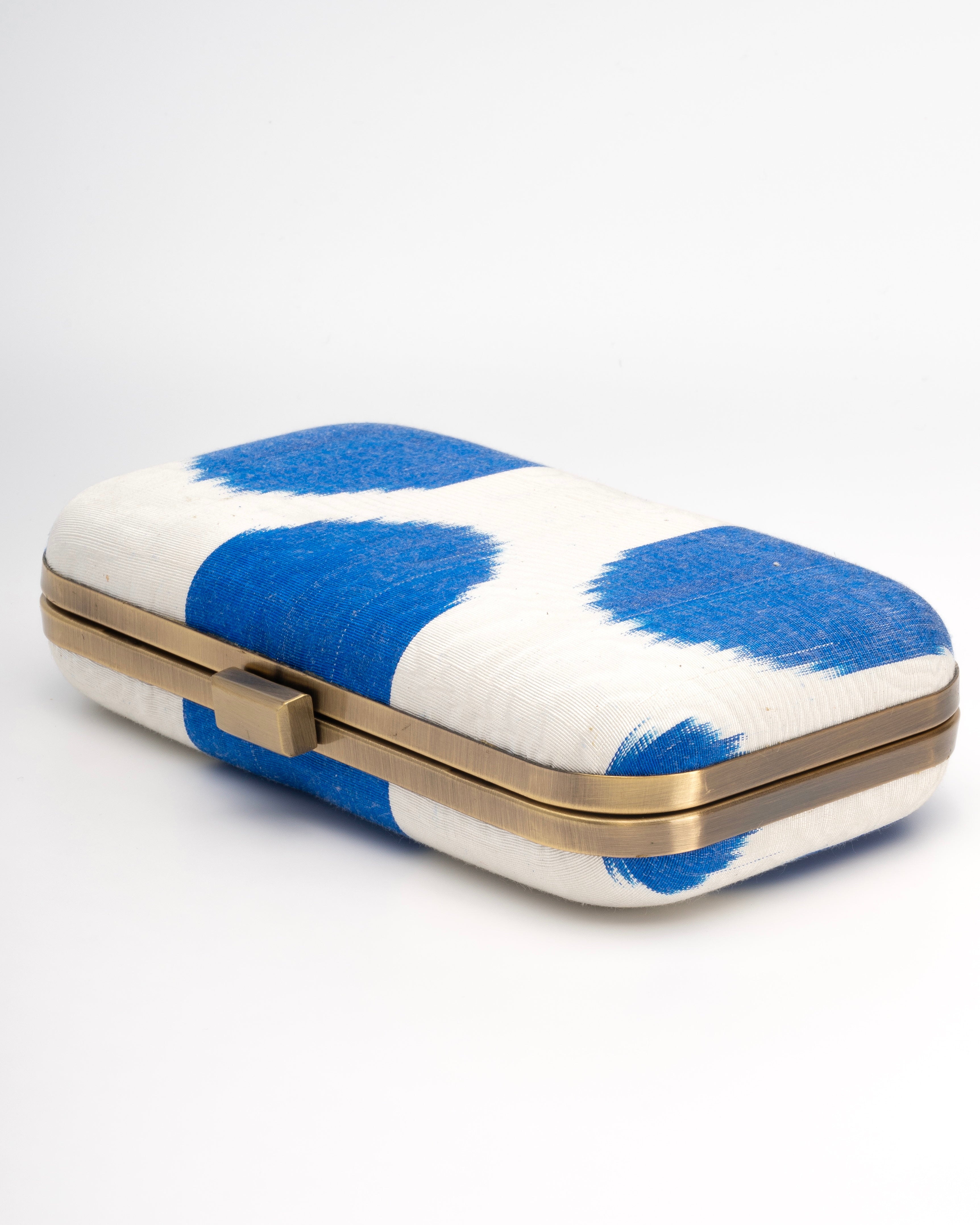 Unique Frankitas rectangular clutch with vibrant handwoven Ikat textile, showcasing Southeast Asian craftsmanship