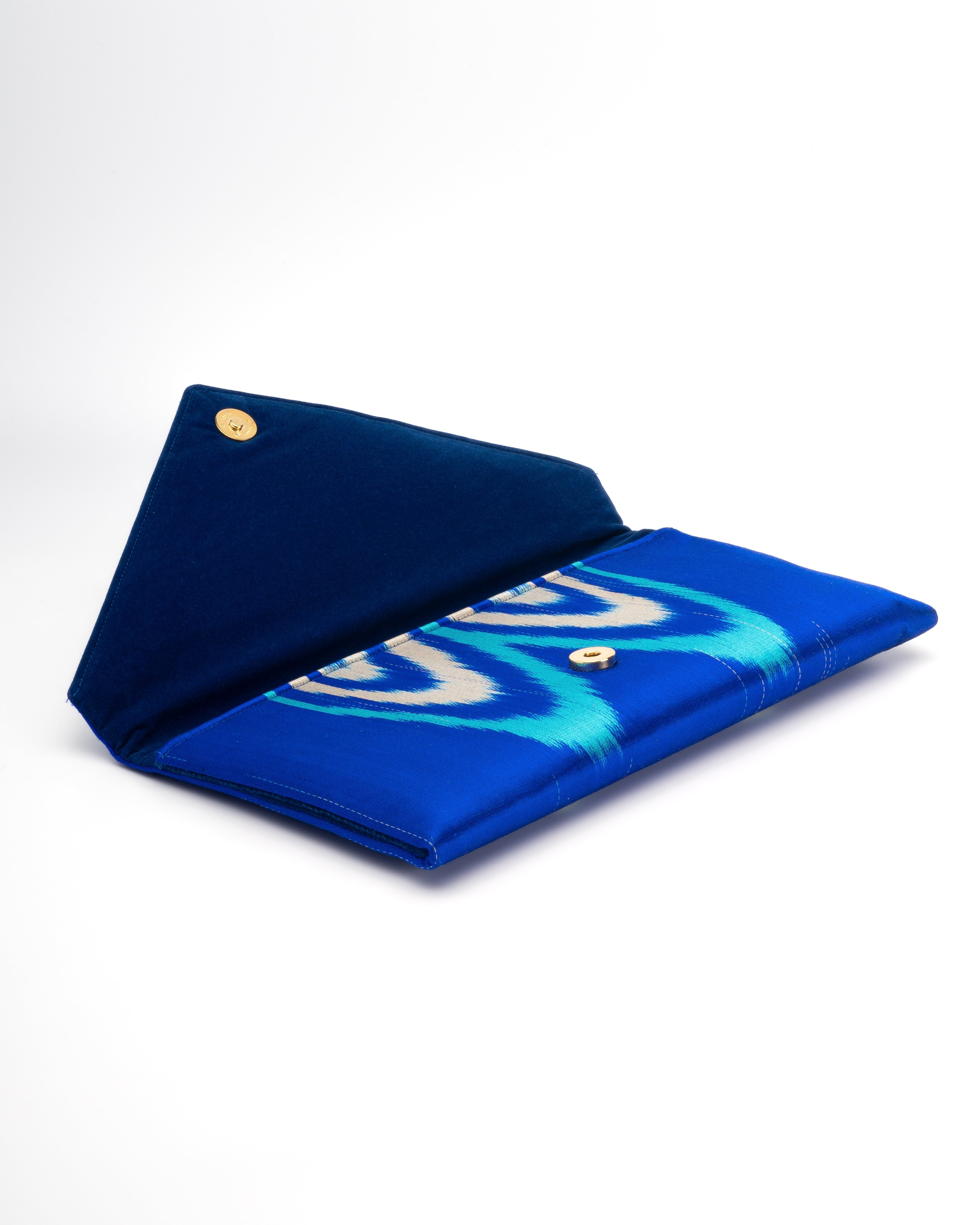 Capturing threads of handwoven materials such as Silk Ikat from Central Asian - Frankitas classic envelope clutch handbag