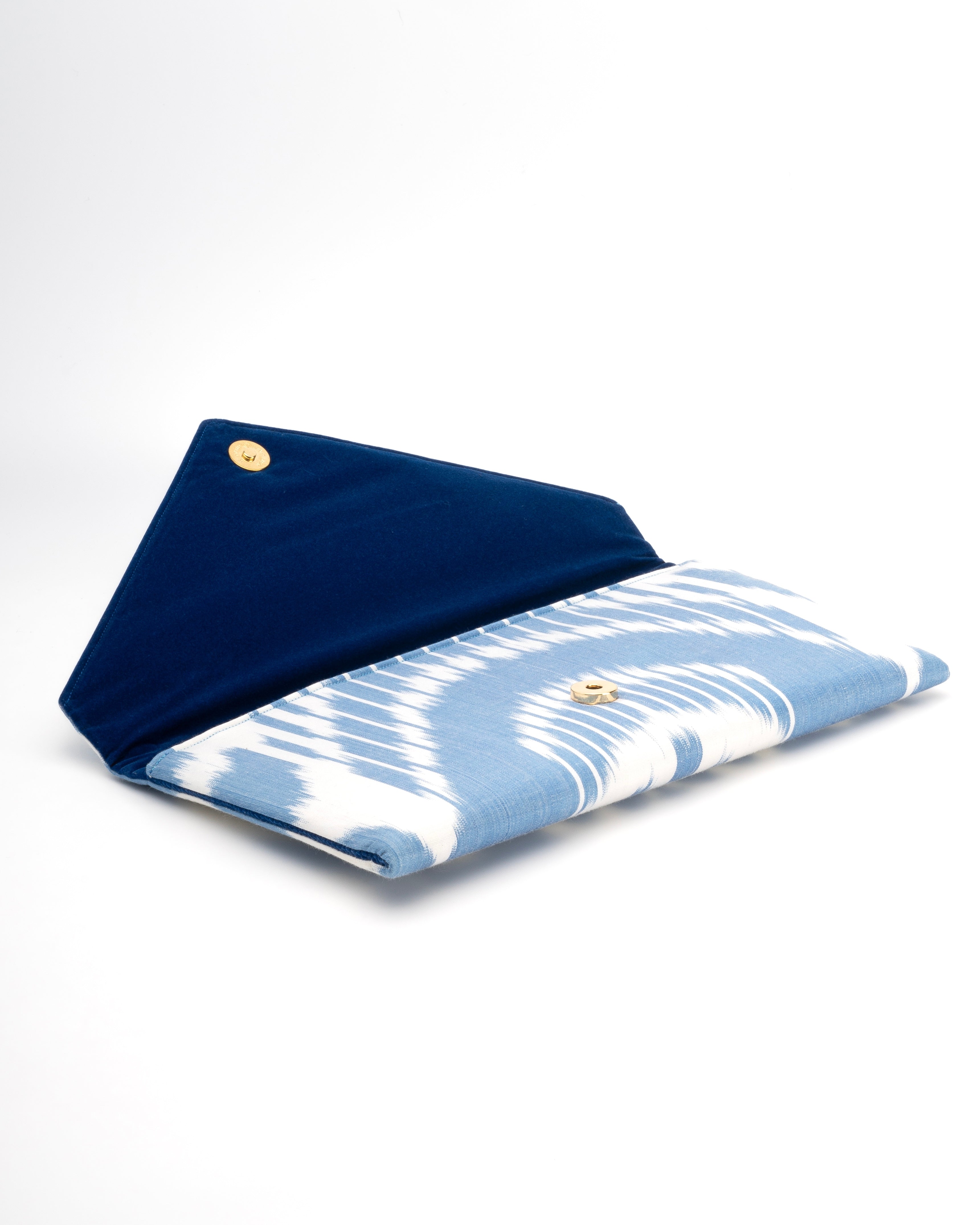 Envelope clutch combining heritage Ikat weaving and modern design by Frankitas in a baby blue and white tribal pattern