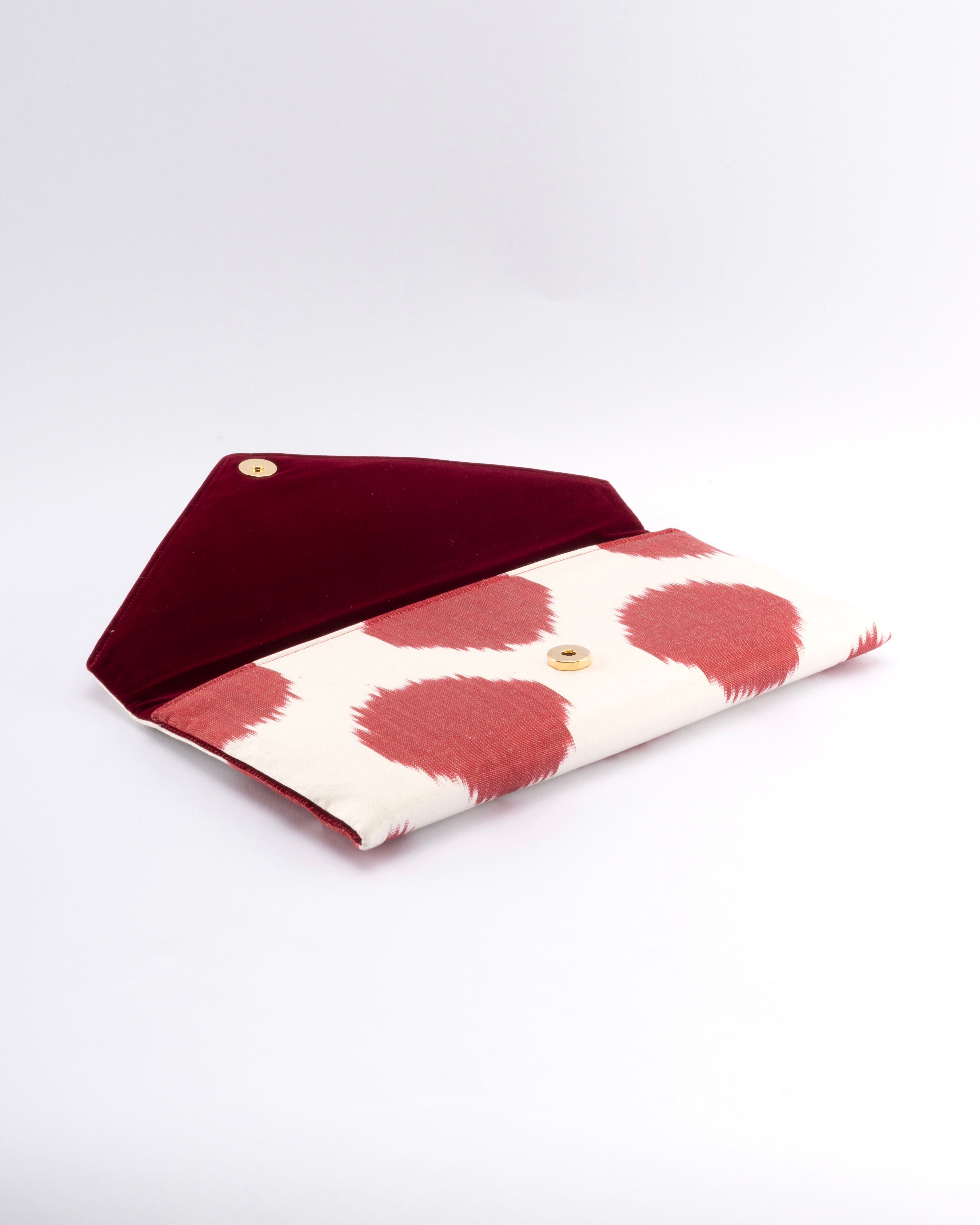 Frankitas classic envelope Titin clutch in a timeless design that celebrates handwoven silk ikat craftsmanship.