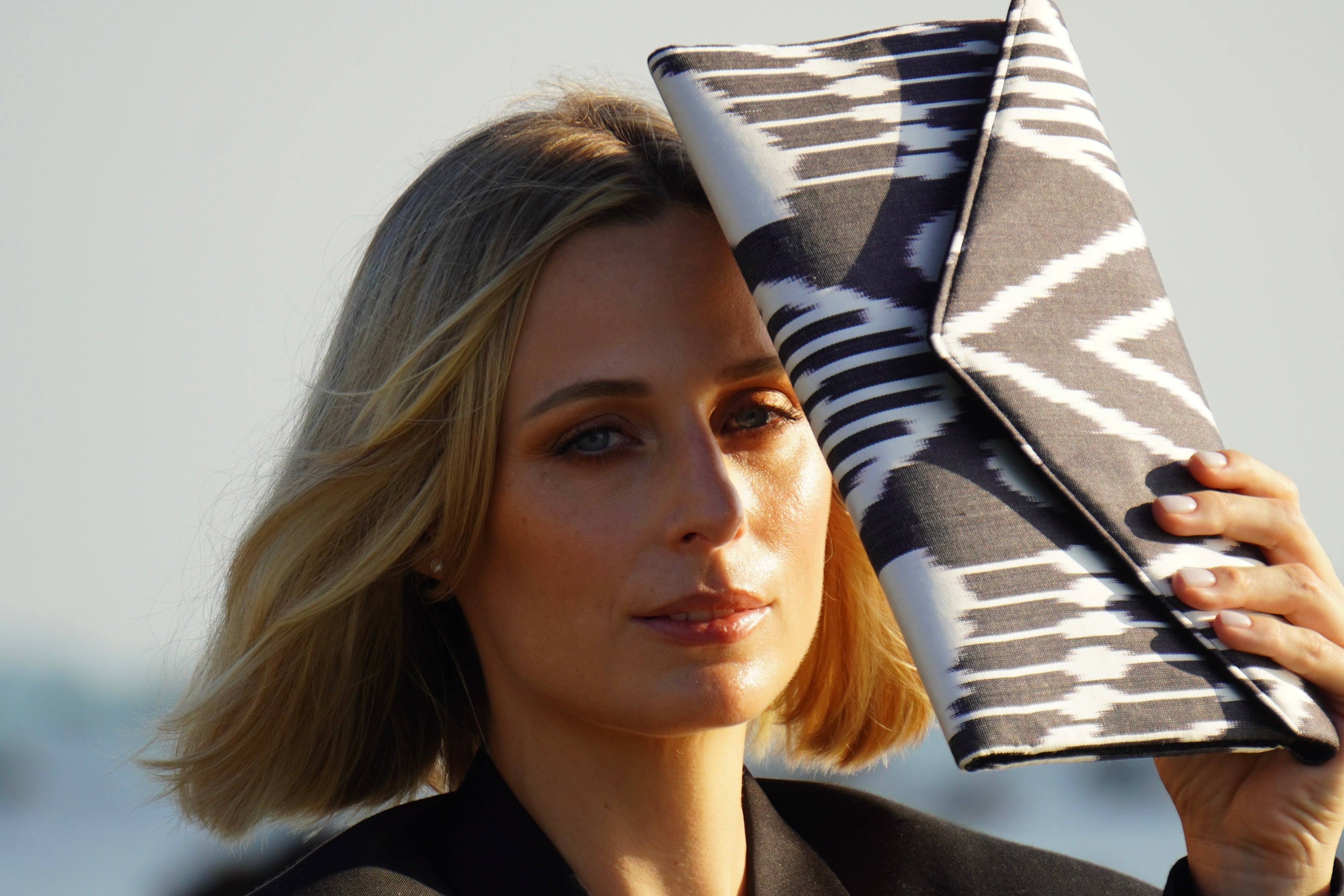 Modern Frankitas black and white clutch handbag made from handwoven Central Asian geometric silk Ikat