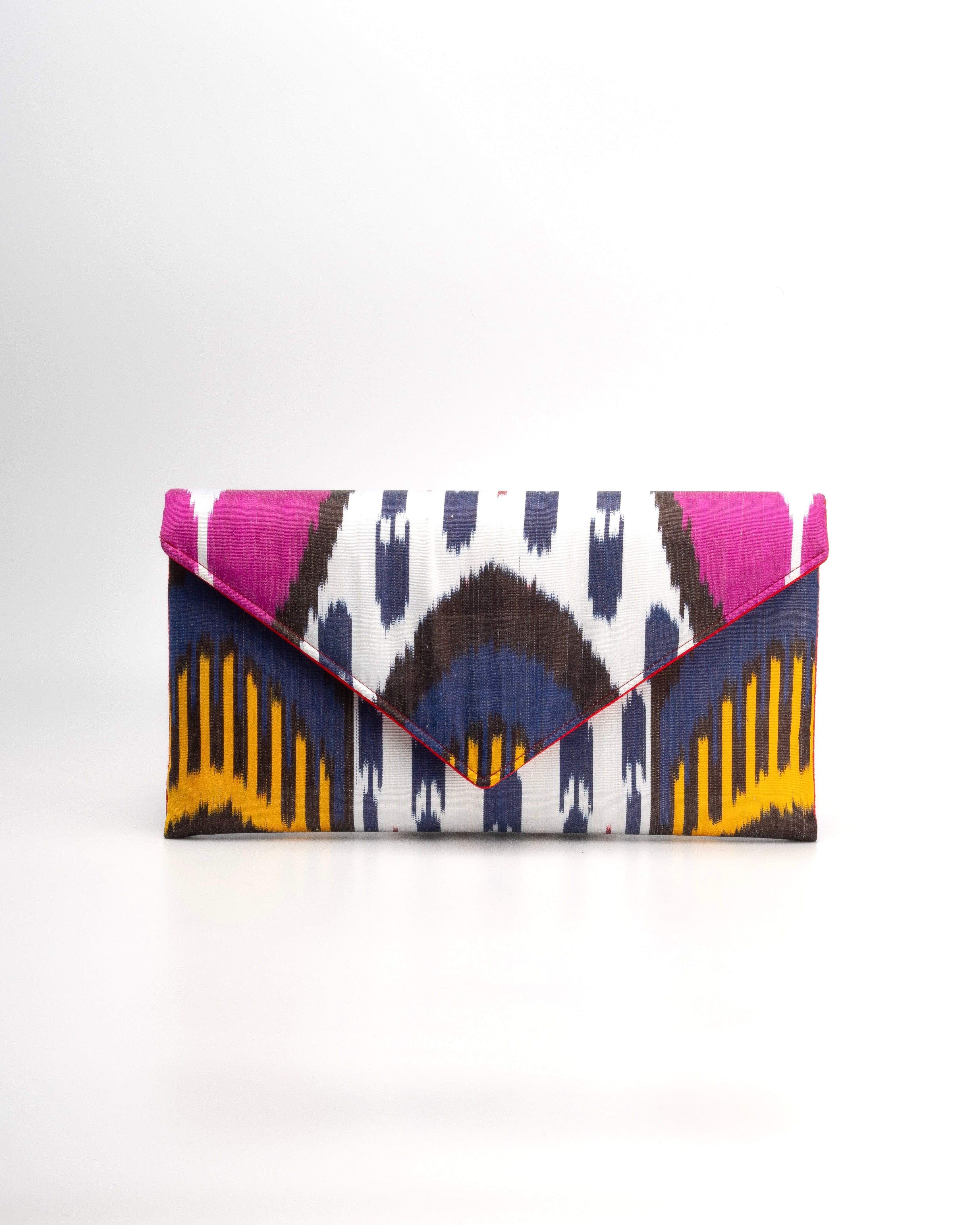 Elegant colorful clutch handbag made with vibrant Silk Ikat fabric, artisan-crafted by Frankitas to celebrate heritage