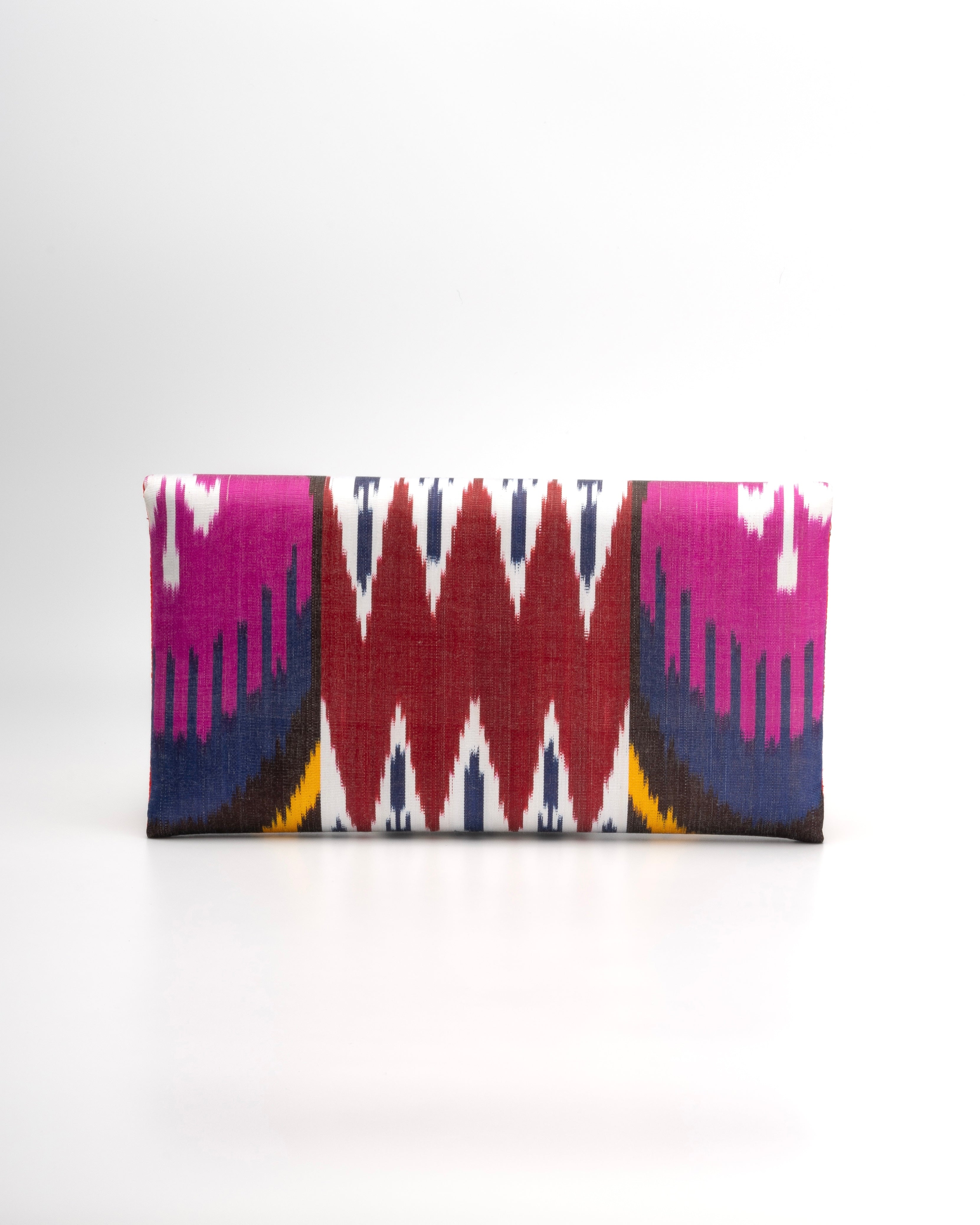 Frankitas silk Ikat clutch in rich, multicoloued woven fabric, a modern reinterpretation of traditional artistry