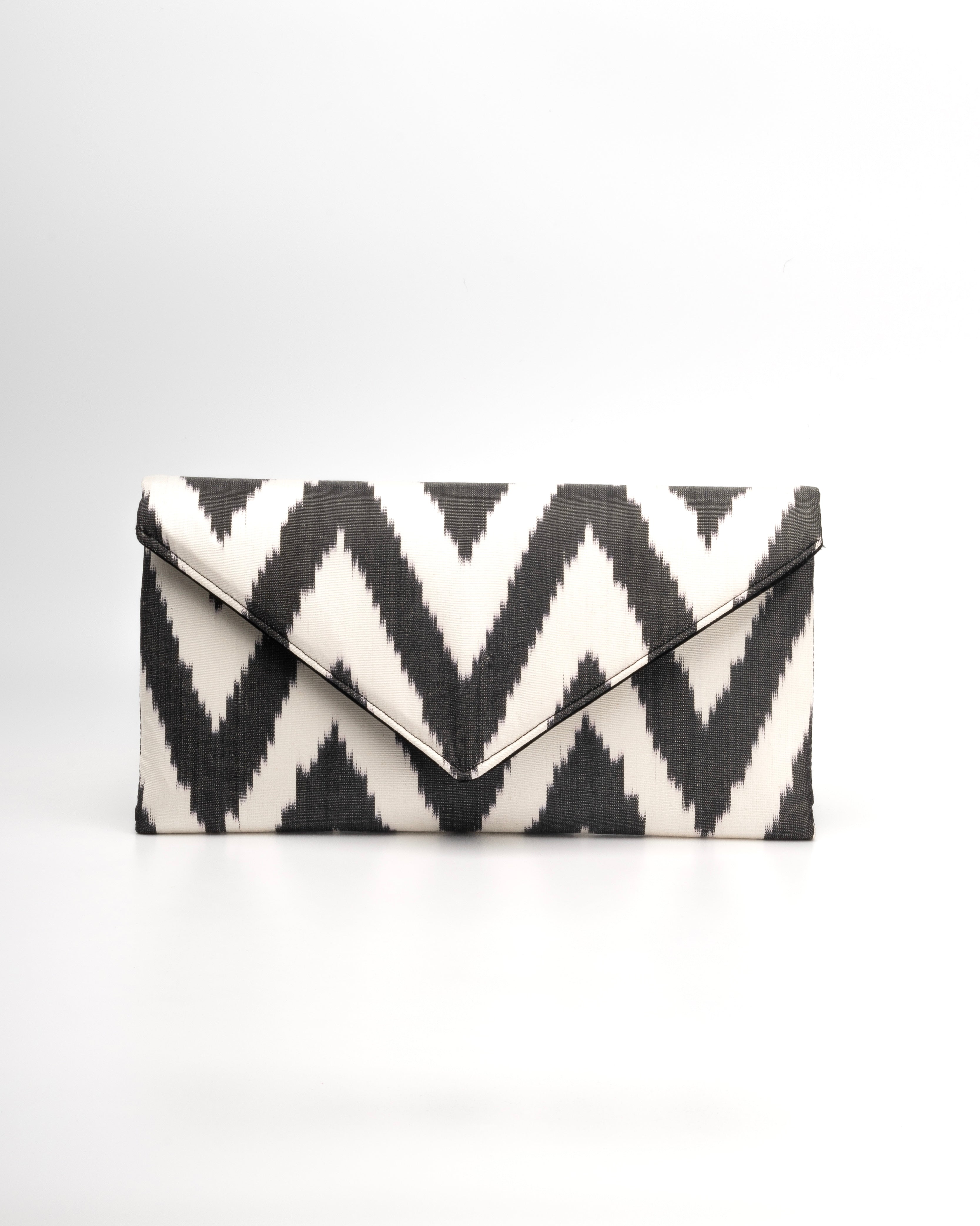 Frankitas’ iconic envelope clutch brings traditional silk ikat weaving into a sleek, classic silhouette - black and white chevron zigzag pattern