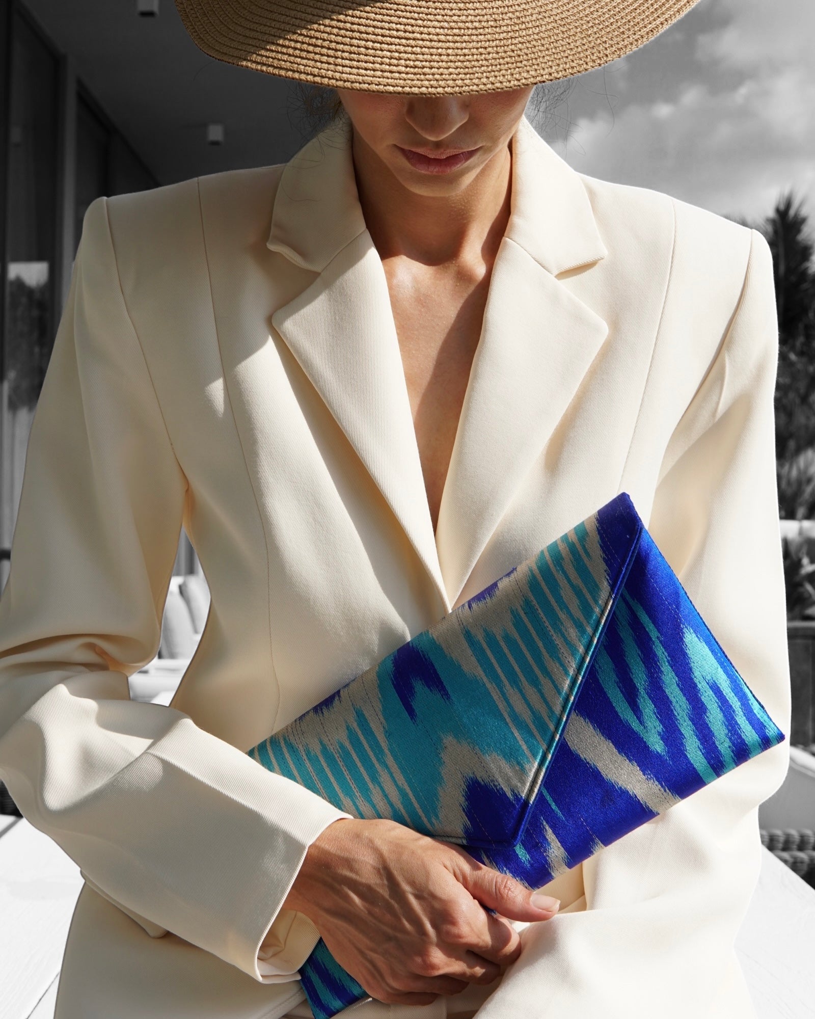 Deep blue and turquoise patterned silk Ikat envelope clutch, hand‑loomed in Central Asia by Frankitas